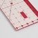 A quilting and patchwork ruler, 15 × 5 cm, transparent/pink color