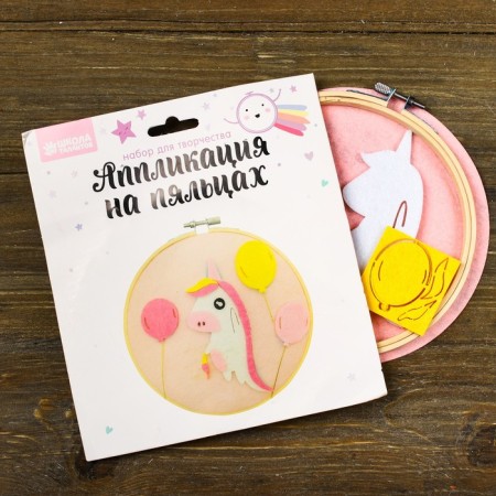 Application from textile details on the hoop "Unicorn with balls"-1