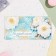 Money envelope "Congratulations!" glitter, flowers in the background, 17x8 cm