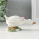 Polystone souvenir "Gusenok with a pink bow in a clearing" 12x5x5.5 cm