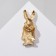 Icon "rabbit" with a bouquet, colored in gold