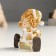 Souvenir Polystone "Baby in a gold caftan and cap, sits" mix 4x5x8 cm