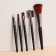 A set of makeup brushes, 5 objects, black/pink gold color