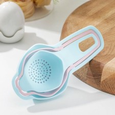 A set for baking, 3 objects: a strainer, a separator for eggs, funnel, color mix