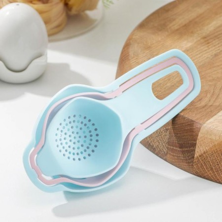 A set for baking, 3 objects: a strainer, a separator for eggs, funnel, color mix