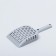 A scoop for cleaning a cat toilet, gray
