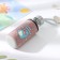 A glass bottle in a “dino” case, 300 ml, h = 17 cm, mix drawing