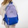 A backpack with a zipper, 4 outer pockets, lilac color/blue color