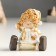 Souvenir Polystone "Baby in a gold caftan and cap, sits" mix 4x5x8 cm
