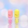 A set of lip gloss with honey and strawberries