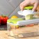 Vegetable engine - Shinkovka with interchangeable nozzles and a shares container, 6 nozzles, 14 × 12.5 × 38.1 cm, white, green color