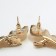 Earrings with rhinestones "bows" wings, white color in gold
