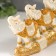 Polystone souvenir "Seven white elephants in golden blankets on a carved tusk" 11x3.5x28.5 cm