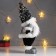 Interior doll "Santa Claus in a black fur coat and cap with sequins" 41x11x16 cm