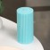 Candle-cylinder with faces, 5x10 cm, turquoise, 6 hours