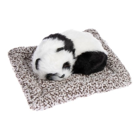 Toy on a car panel, panda on a pillow, white-black color