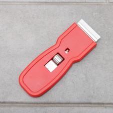 Scraper with a blade for windows, walls and floor