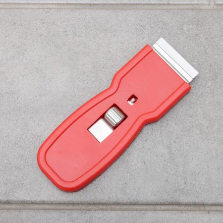 Scraper with a blade for windows, walls and floor