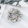 Brooch "Circle of twisted", black and white color in silver