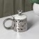 Ceramic mug with a spoon "Stylish Bear", 320 ml, silver color