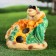 Garden figure "Snake with sunflower" green, 26x30x25cm
