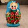 Matryoshka "God's cow", blue dress, 5 puppet, 9-10 cm