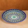 Plate of the Rishtan ceramics "Flowers", 26 cm, blue mix